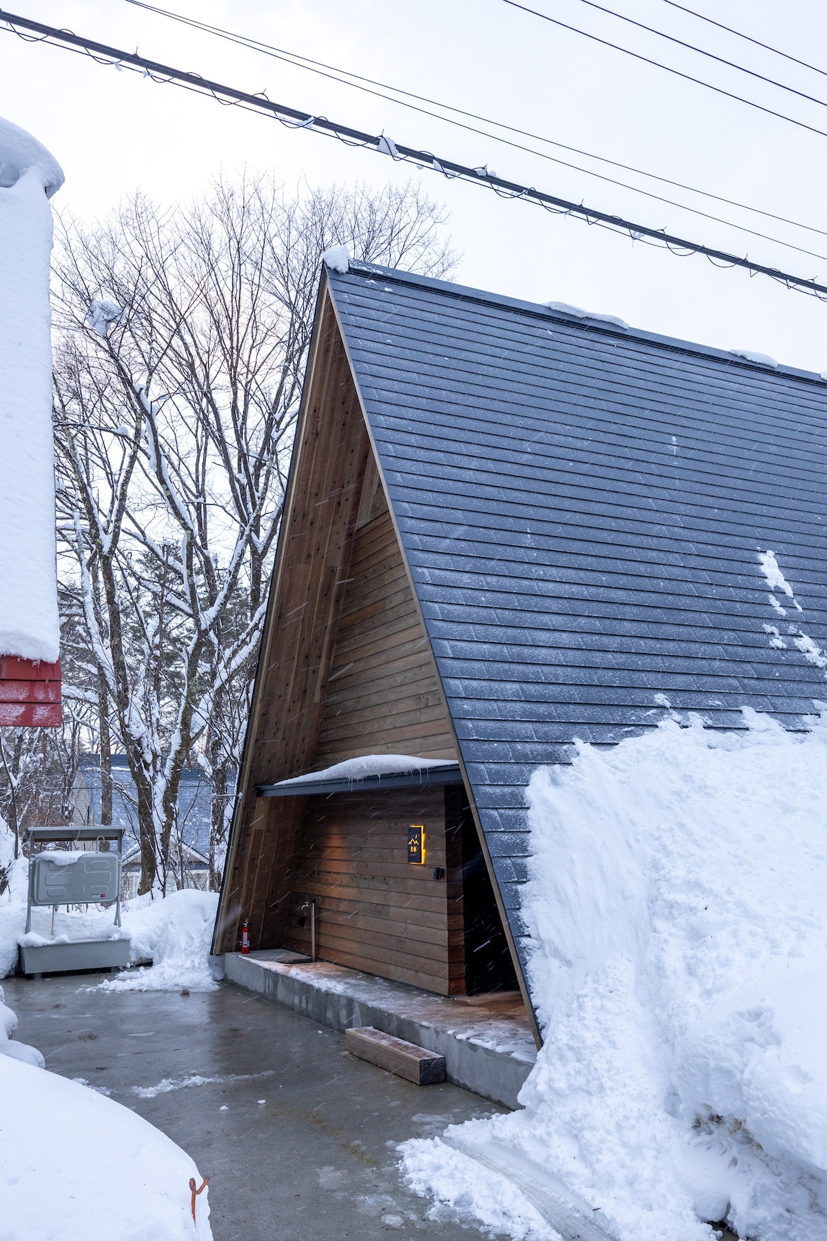 Heated driveway at the front of the chalet, two cars can be parked in a line.